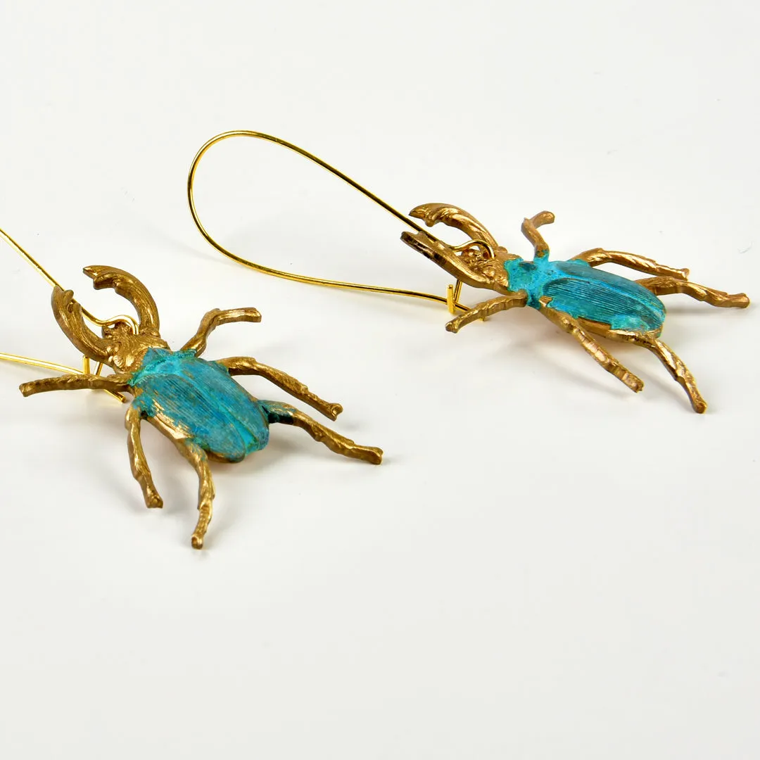 WE DREAM IN COLOR VERDIGRIS BEETLE EARRINGS